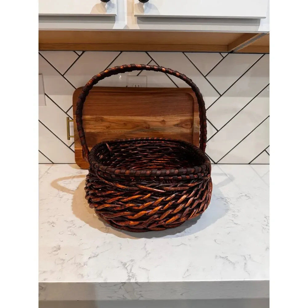 dark stained willow basket rustic handwoven texture sturdy center handle vintage